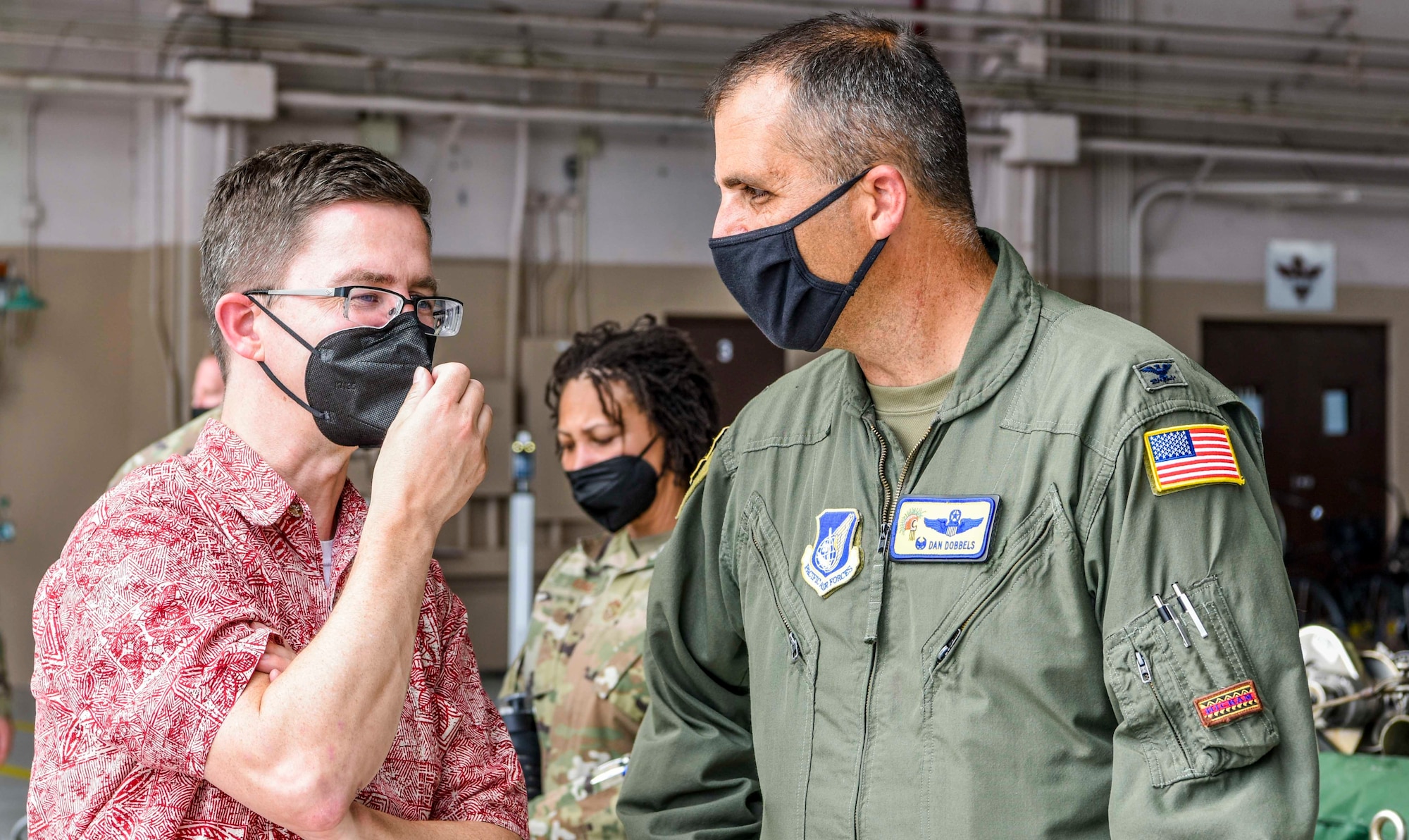 U.S. Air Force Col. Daniel Dobbels, 15th Wing commander, discusses the partnership with the Daniel K. Inouye International Airport and the importance of the shared use airfield with U.S. staff delegation members of the House Appropriations Committee while visiting Airmen at Joint Base Pearl Harbor-Hickam, Hawaii, Aug. 19, 2021. The purpose of the visit was to see how the 15th Wing and Hawaiian Air National Guard utilize Total Force Integration to accomplish the mission to ensure a free and open Indo-Pacific. (U.S. Air Force photo by Tech. Sgt. Anthony Nelson Jr.)