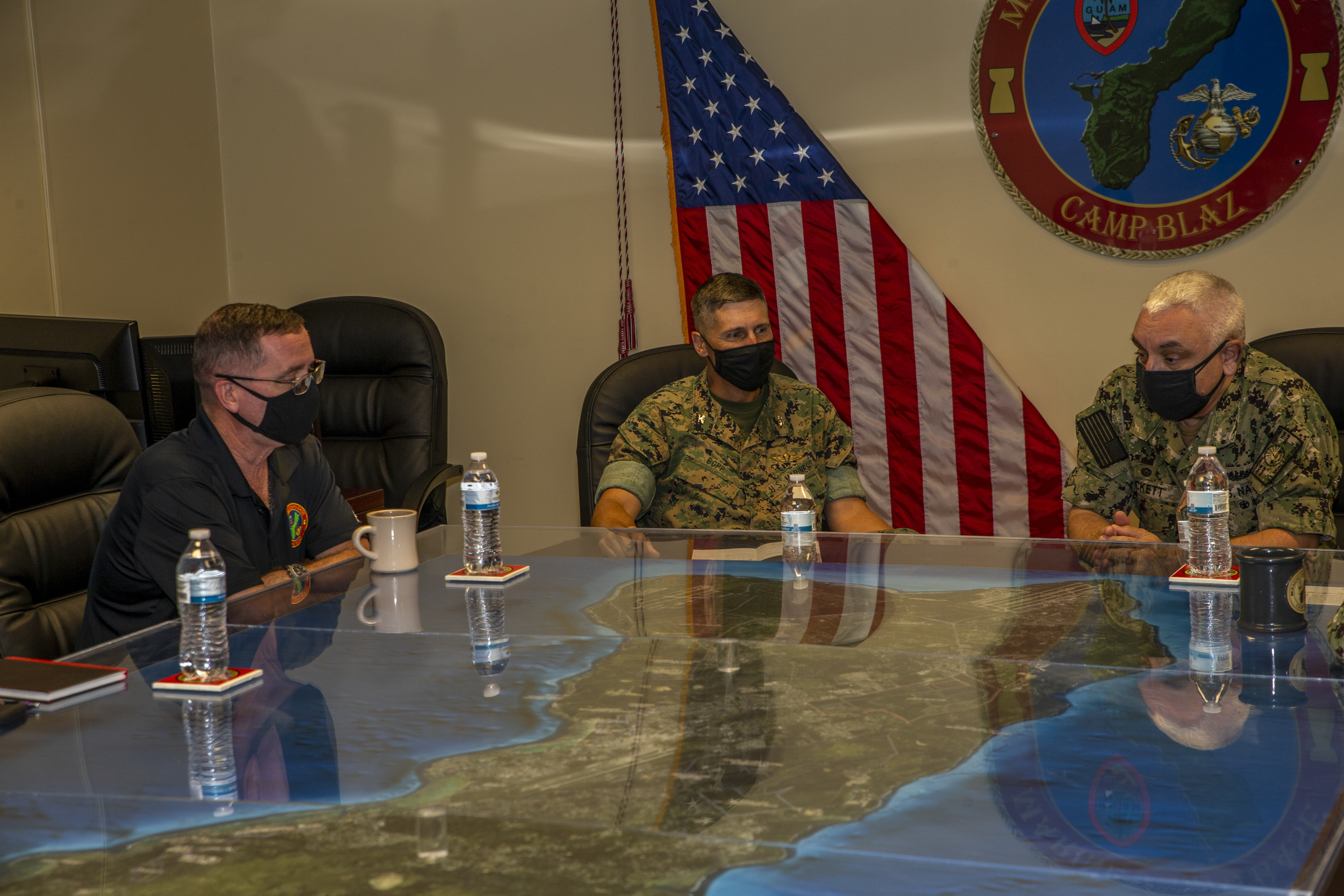 Col. Christopher Bopp, the Marine Corps Base (MCB) Camp Blaz Commanding Officer, center, briefs U.S. Navy Capt. Michael Luckett, the U.S. Naval Base Guam Commanding Officer, during a visit to MCB Camp Blaz, Aug. 31, 2021.