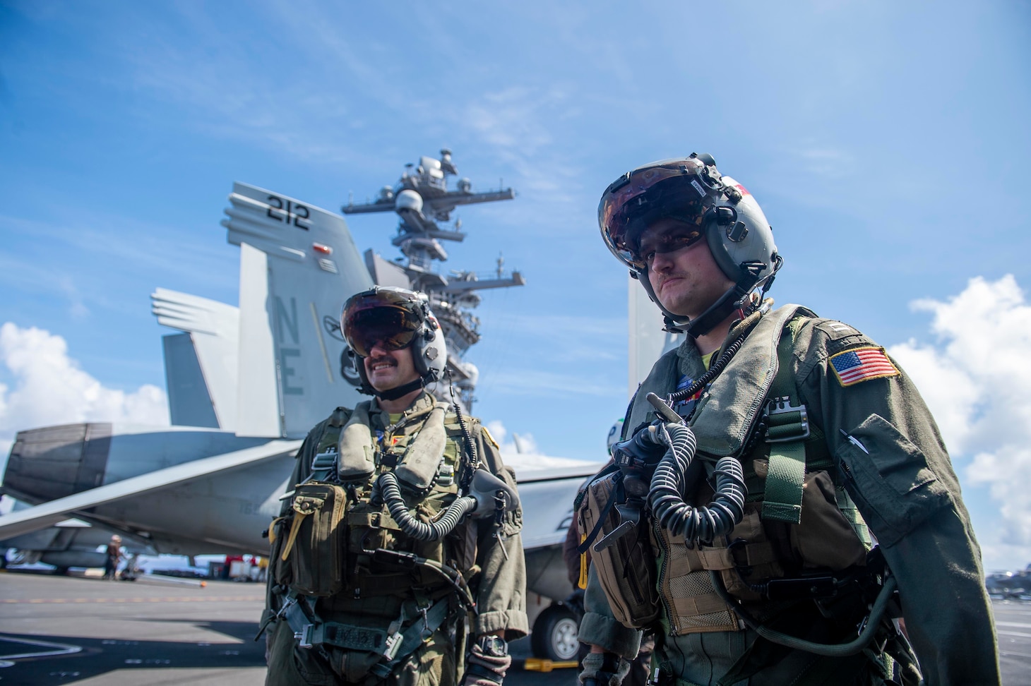 PACIFIC OCEAN (Aug. 26, 2021) Pilots prepare to enter an F/A-18F Super Hornet assigned to the “Bounty Hunters” of Strike Fighter Squadron (VFA) 2, on the flight deck aboard Nimitz-class aircraft carrier USS Carl Vinson (CVN 70), Aug. 26, 2021. Carl Vinson Carrier Strike Group is on a rotational deployment in the U.S. 7th Fleet area of operations to enhance interoperability with allies and partners, and to serve as a ready-response force in support of a free and open Indo-Pacific region. (U.S. Navy photo by Mass Communication Specialist Seaman Isaiah Williams)