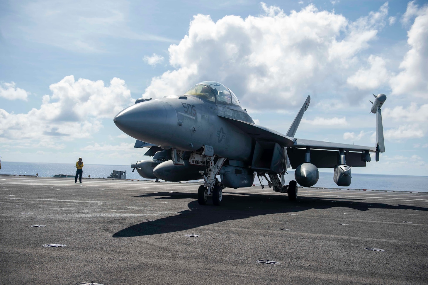PACIFIC OCEAN (Aug. 26, 2021) An EA-18G Growler, assigned to the “Gauntlets” of Electronic Attack Squadron (VAQ) 136, awaits clearance on the flight deck aboard Nimitz-class aircraft carrier USS Carl Vinson (CVN 70), Aug. 26, 2021. Carl Vinson Carrier Strike Group is on a rotational deployment in the U.S. 7th Fleet area of operations to enhance interoperability with allies and partners, and to serve as a ready-response force in support of a free and open Indo-Pacific region. (U.S. Navy photo by Mass Communication Specialist Seaman Isaiah Williams)