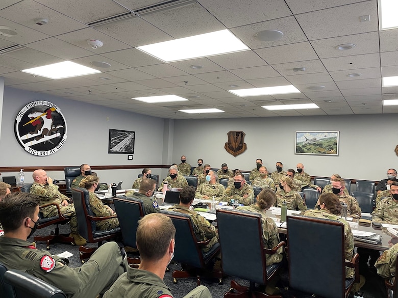 Photo of U.S. Air Force Airmen sitting at a table