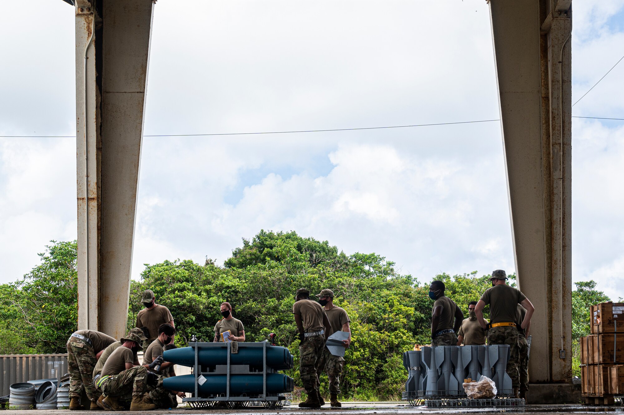 U.S. Air Force Airmen assigned to the 2nd Munitions Squadron and 707th Maintenance Squadron, Barksdale Air Force Base, Louisiana, build BDU-50 training bombs for Bomber Task Force (BTF) missions at Andersen Air Force Base, Guam, Aug. 27, 2021. BTF missions enable crews to maintain a high state of readiness and proficiency, and validate our always-ready global strike capability. (U.S. Air Force photo by Staff Sgt. Devin M. Rumbaugh)