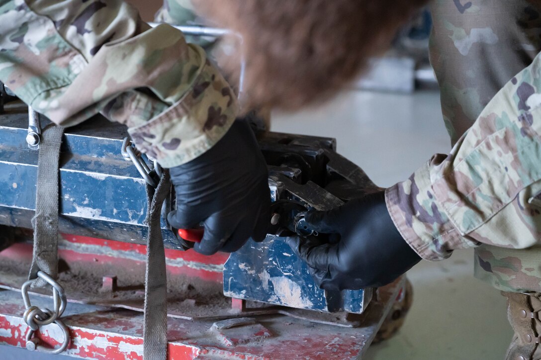 Senior Airman Travis Thornton, 741st Maintenance Squadron mechanical and pneudraulics technician, inspects a component of a hydraulic actuator power unit July 28, 2021, at Malmstrom Air Force Base, Mont.