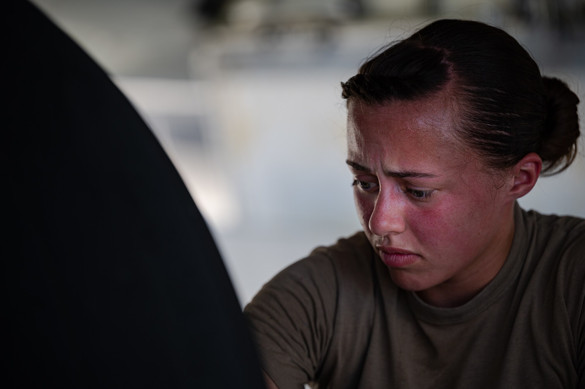 U.S. Air Force Staff Sgt. Colleen Clay, 961st Aircraft Maintenance Unit crew chief, inspects the tire of an E-3 Sentry at Kadena Air Base, Japan, Aug. 30, 2021. The 961st AMU is critical in ensuring the E-3 Sentry is capable of delivering decisive air and cyberspace capabilities. (U.S. Air Force photo by Airman 1st Class Stephen Pulter)