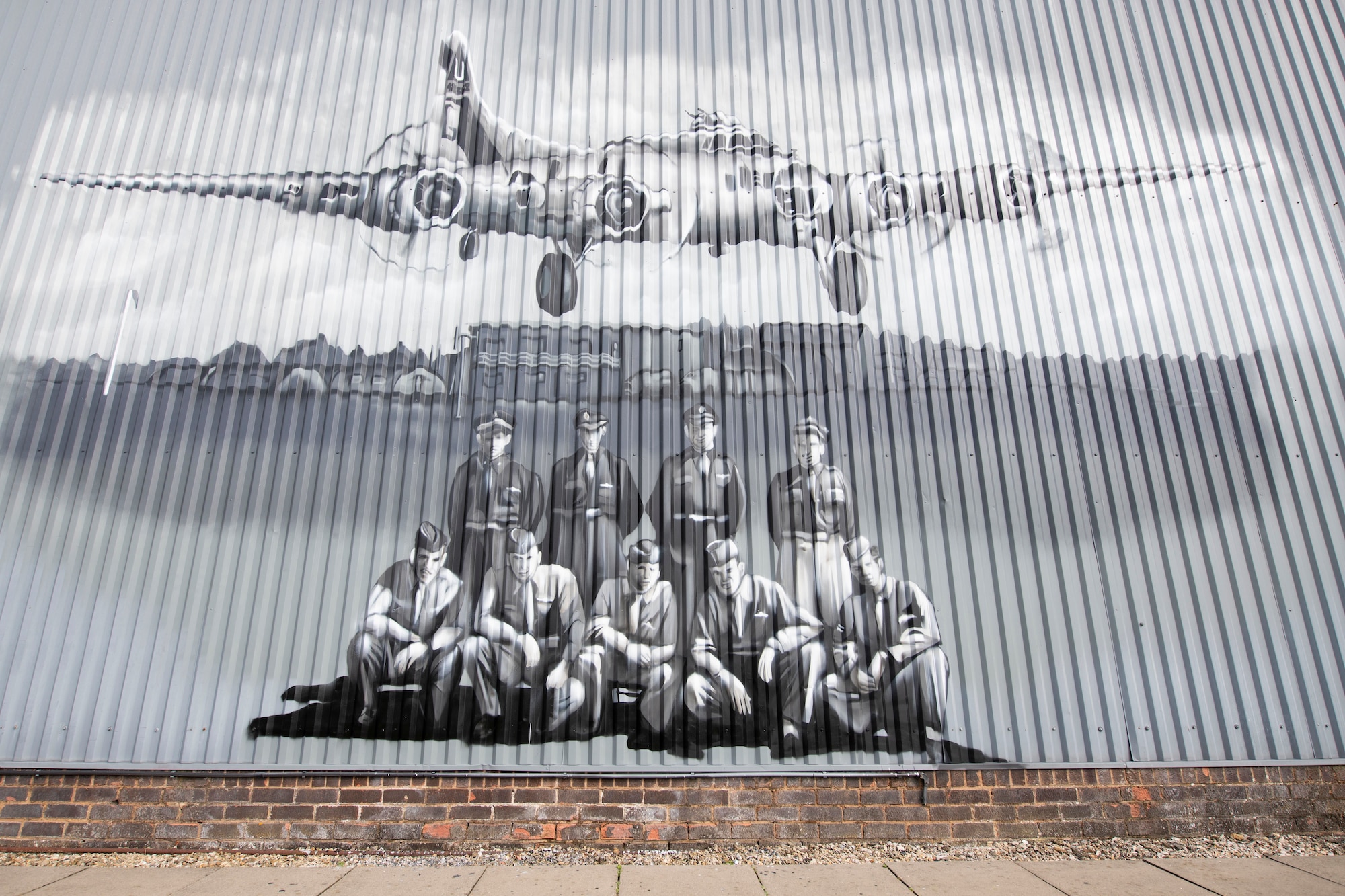 U.S. Air Force Col. Abe Jackson, U.S. European Command Joint Intelligence Operations Center Europe Analytic Center commander, worked with the staff of the Flying Club Conington at Peterborough Conington Airfield, to commemorate the 457th Bombardment Group Airmen who served and flew missions from a World War II base, RAF Glatton, England, Aug. 19, 2021. (U.S. Air Force photo by Senior Airman Jennifer Zima)
