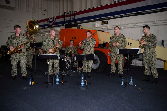 Members of the U.S. Naval Forces Europe and Africa band play at a key leadership engagement with Gabonese and French military personnel, and U.S. embassy staff aboard the Expeditionary Sea Base USS Hershel "Woody" Williams (ESB 4), Sept. 1, 2021. Hershel "Woody" Williams is on a scheduled deployment in the U.S. Sixth Fleet area of operations in support of U.S. national interests and security in Europe and Africa.