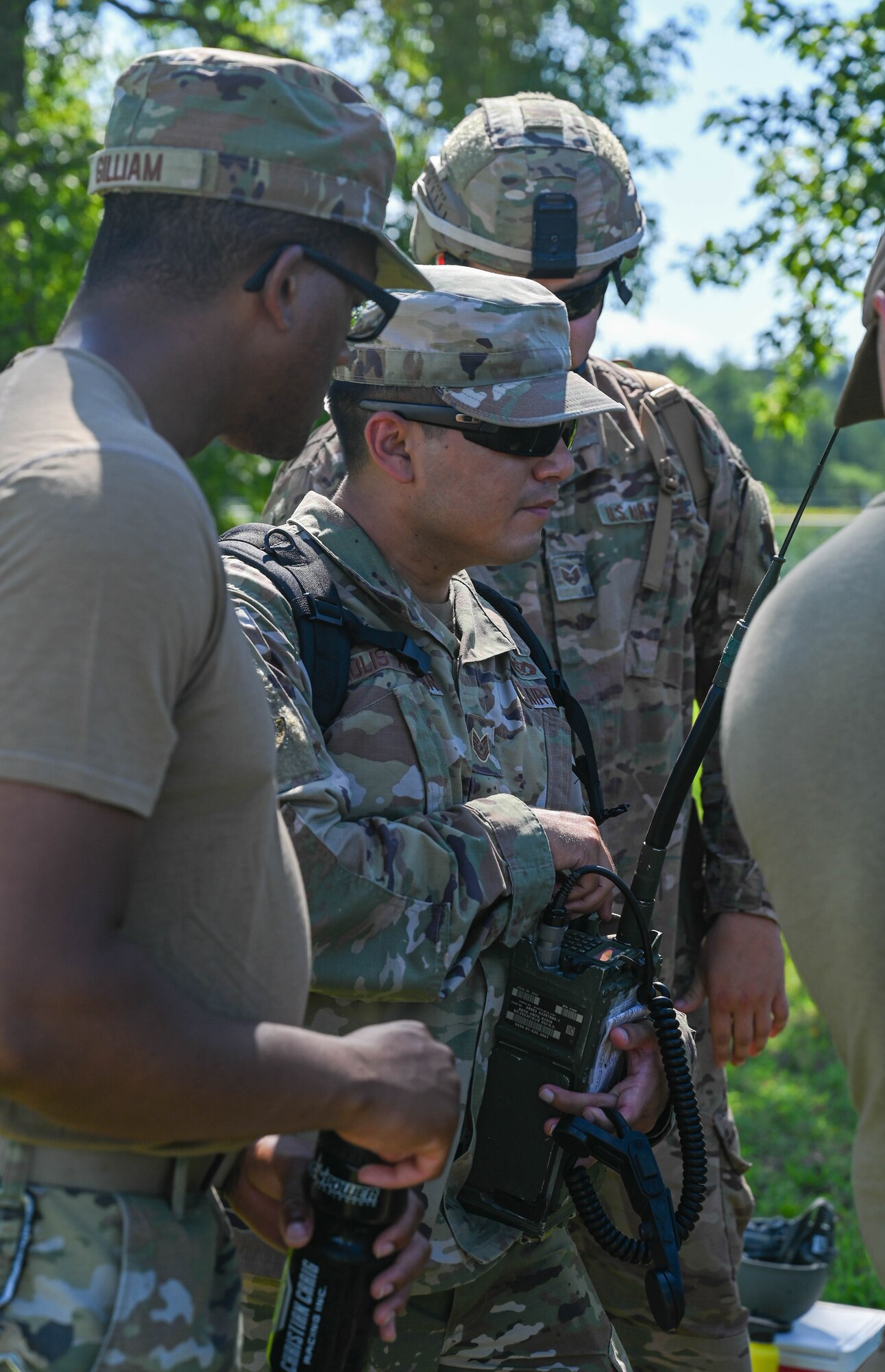 U.S. Air Force Airmen from the 633d Civil Engineer Squadron, operate a radio during joint tactical convoy operations training at Joint Base Langley-Eustis, Virginia, August 19, 2021. Army Soldiers assigned to the 149th Seaport Operations Company, 7th Transportation Brigade, instructed Airmen on the different aspects of convoy procedures and safety. (U.S. Air Force photo by Senior Airman Sarah Dowe)