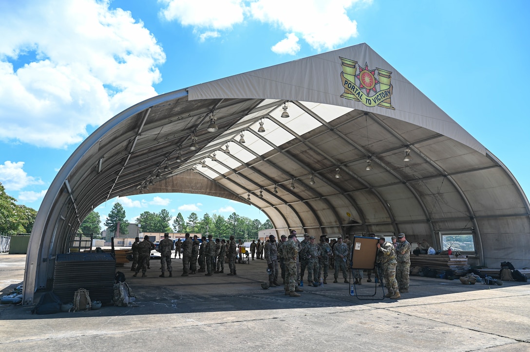 U.S. Air Force Airmen from the 633d Civil Engineer Squadron, learn about unexploded ordinance procedures and reporting and medevac techniques during joint tactical convoy operations training at Joint Base Langley-Eustis, Virginia, August 19, 2021. Army Soldiers assigned to the 149th Seaport Operations Company, 7th Transportation Brigade, taught each group of Airmen the skills necessary to succeed while in a convoy. (U.S. Air Force photo by Senior Airman Sarah Dowe)