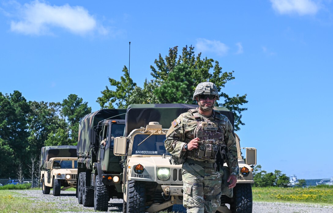 U.S. Army Soldiers assigned to the 149th Seaport Operations Company, 7th Transportation Brigade, leads a convoy during joint tactical convoy operations training at Joint Base Langley-Eustis, Virginia, August 19, 2021. The training taught communication procedures for improvised explosive devices and unexploded ordinance scenarios, how to fill out medevac reports and how to properly operate a radio. (U.S. Air Force photo by Senior Airman Sarah Dowe)