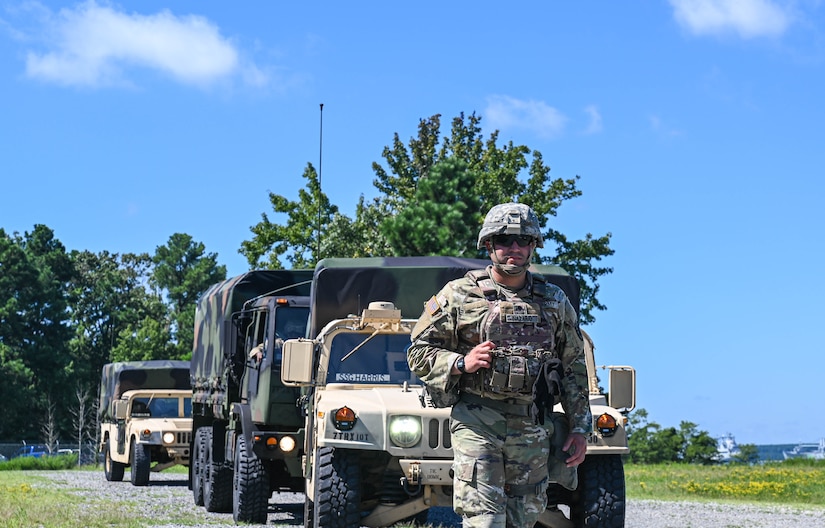 U.S. Army Soldiers assigned to the 149th Seaport Operations Company, 7th Transportation Brigade, leads a convoy during joint tactical convoy operations training at Joint Base Langley-Eustis, Virginia, August 19, 2021. The training taught communication procedures for improvised explosive devices and unexploded ordinance scenarios, how to fill out medevac reports and how to properly operate a radio. (U.S. Air Force photo by Senior Airman Sarah Dowe)