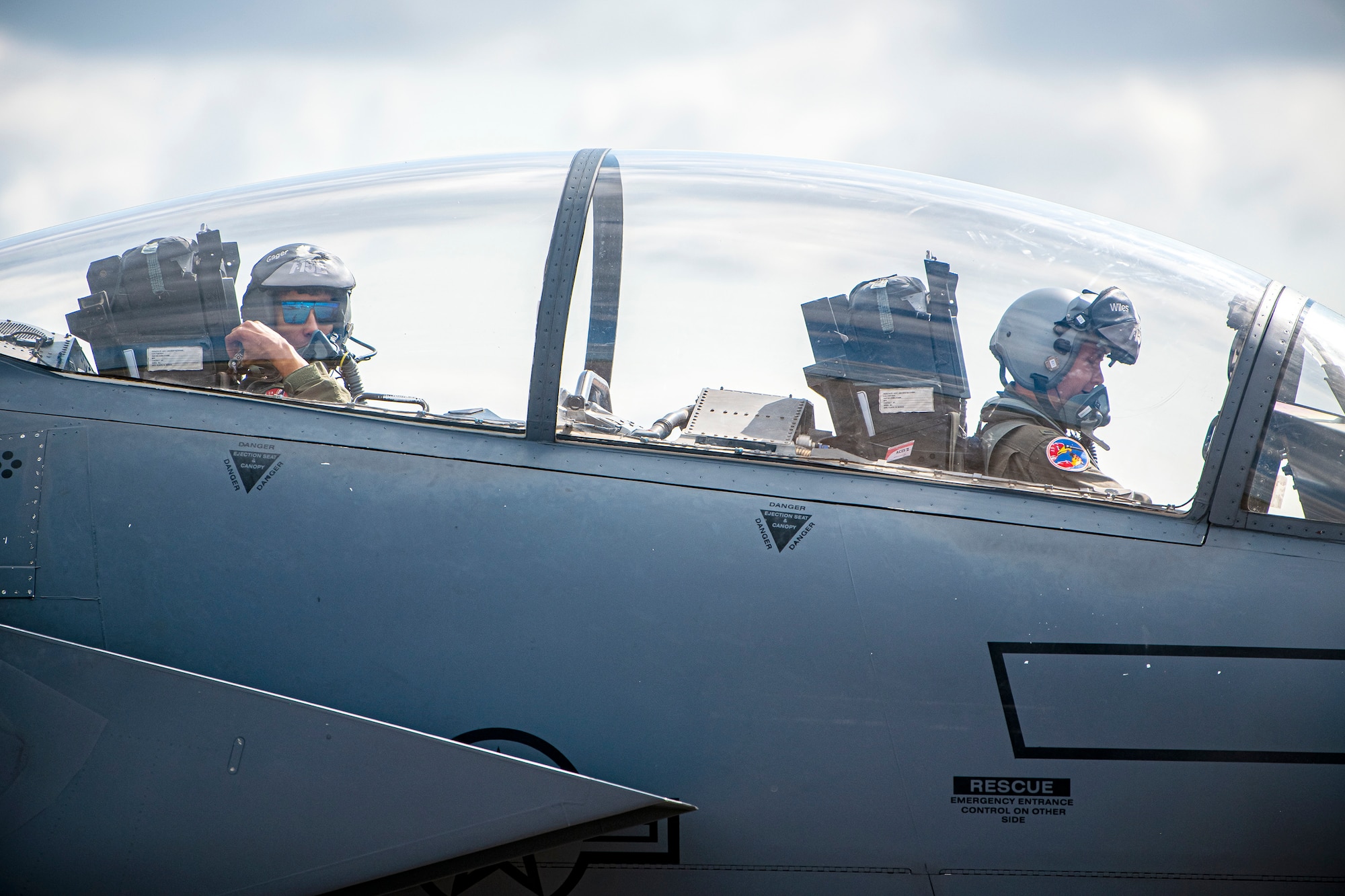 U.S. Air Force 1st Lt. Kyle Gager, left, 492d Fighter Squadron weapons systems officer, and 1st Lt. Zach Wiles, 492d FS pilot, sit in the cockpit of an F-15E Strike Eagle during an Agile Combat Employment exercise at RAF Fairford, England, Aug. 23, 2021. The exercise enables U.S. forces in Europe to operate from locations with varying levels of capacity and support. This further ensures Airmen and aircrews are postured to deliver lethal combat power across the full spectrum of military operations. (U.S. Air Force photo by Senior Airman Eugene Oliver)