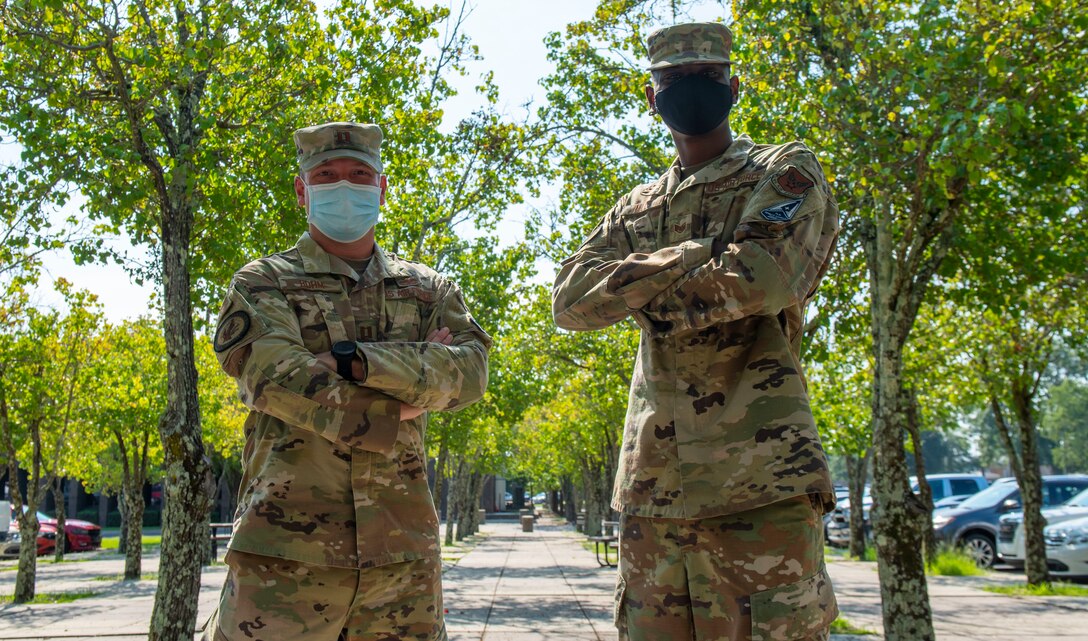 Photo of two Airmen standing together.