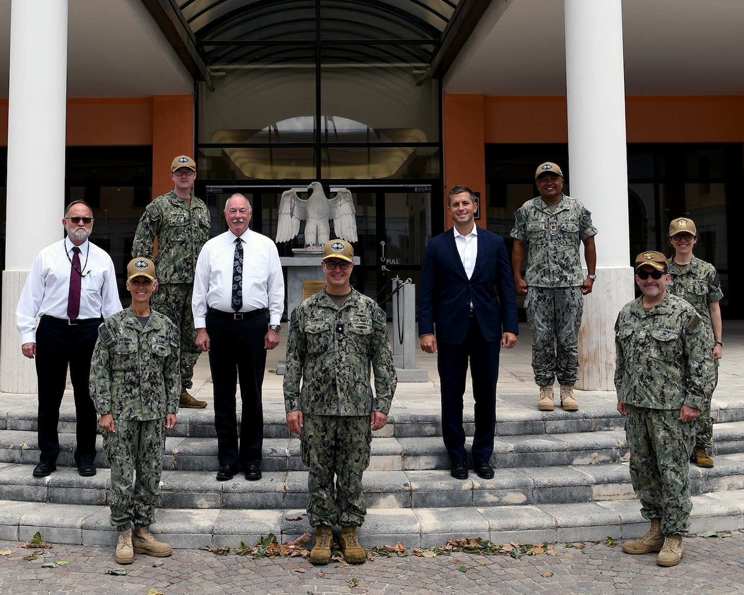 (July 15, 2021) Rear Adm. Michael Curran, Director, Readiness and Logistics, U.S. Naval Forces Europe-Africa, center, poses for a group photo with members of the Host Nation operational planning team assigned to Commander, Naval Forces Europe and Africa (NAVEUR-NAVAF), July 15, 2021, in Naples, Italy. NAVEUR-NAVAF, headquartered in Naples, Italy, conduct the full spectrum of joint and naval operations, often in concert with allied and interagency partners in order to advance U.S. national interests and security and stability in Europe and Africa.