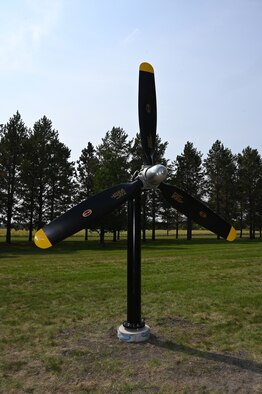 A Large three-blade B-25 propeller is displayed on a pole on the grassy grounds of the North Dakota Veterans Home, Lisbon, N.D., Sept. 1, 2021.