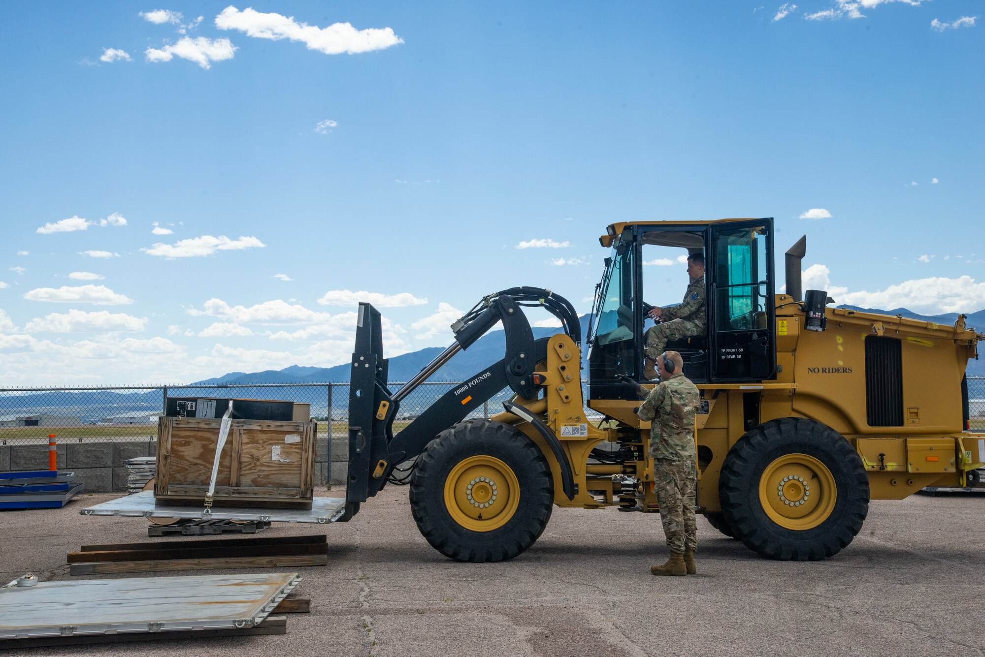 Col Wilson operates a forklift at the 21st LRS