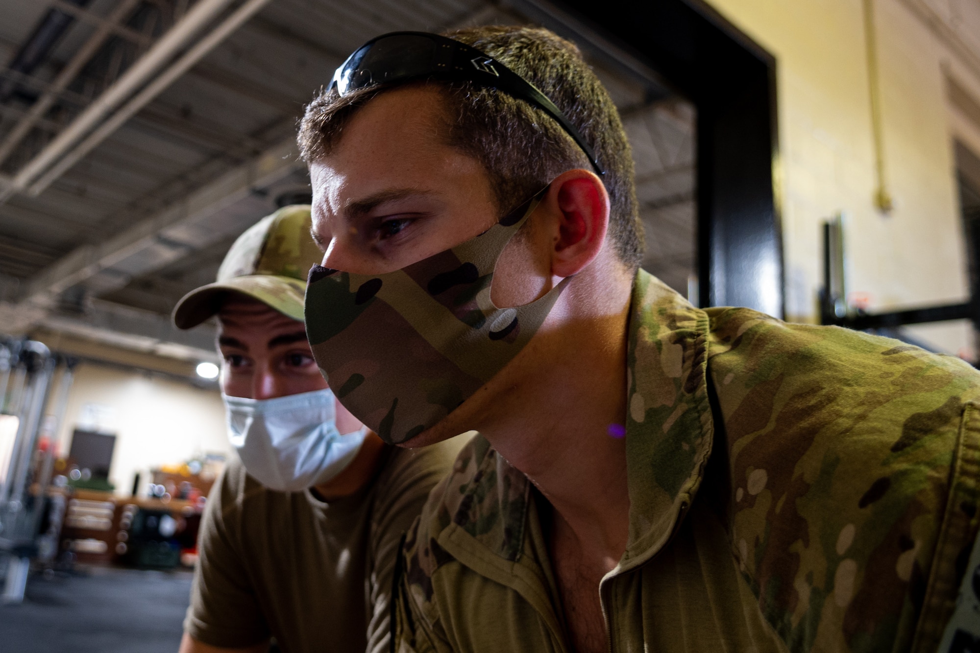 Senior Airman Brian Price, front, and Airman 1st Class Braidon Bray, 4th Civil Engineer Squadron explosive ordnance disposal technicians, use a Man Transportable Robotic System (MTRS) at Seymour Johnson Air Force Base, North Carolina, Aug. 12, 2021. The MTRS allows EOD Airmen to identify and dispose of unexploded ordnance from a safe distance. (U.S. Air Force photo by Senior Airman David Lynn)