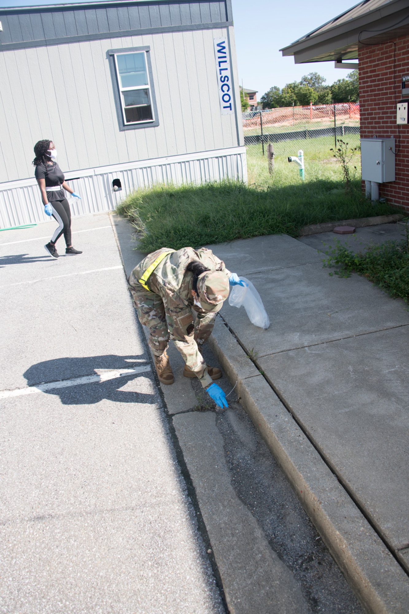 Several 459th ARW Liberators hit the pavement and the grassy areas of the unit today to participate in the wing's Fall clean up for a few hours Sep. 2, 2021. The members were provided trash bags, and reflective belts and gloves for safety. (U.S. Air Force photo by Maj. Tim Smith)