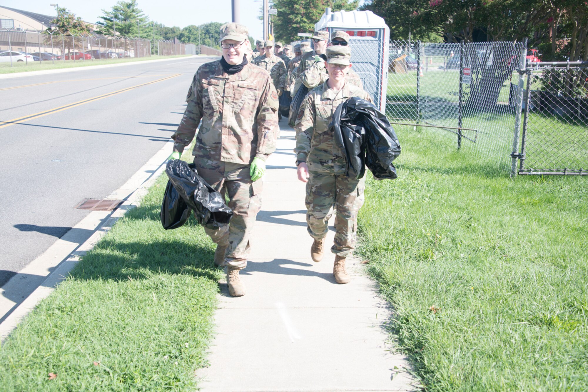 Several 459th ARW Liberators hit the pavement and the grassy areas of the unit today to participate in the wing's Fall clean up for a few hours Sep. 2, 2021. The members were provided trash bags, and reflective belts and gloves for safety. (U.S. Air Force photo by Maj. Tim Smith)