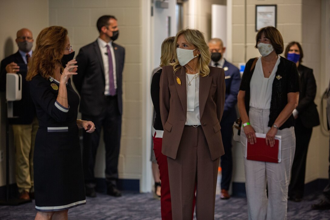 Dr. Jill Biden, first lady of the United States, is briefed by Sarah Wiltgen, assistant chief of staff for Marine Corps Community Services Lejeune-New River, during a visit to the Midway Park Behavioral Health Complex on MCB Camp Lejeune, North Carolina, Sept. 1, 2021.