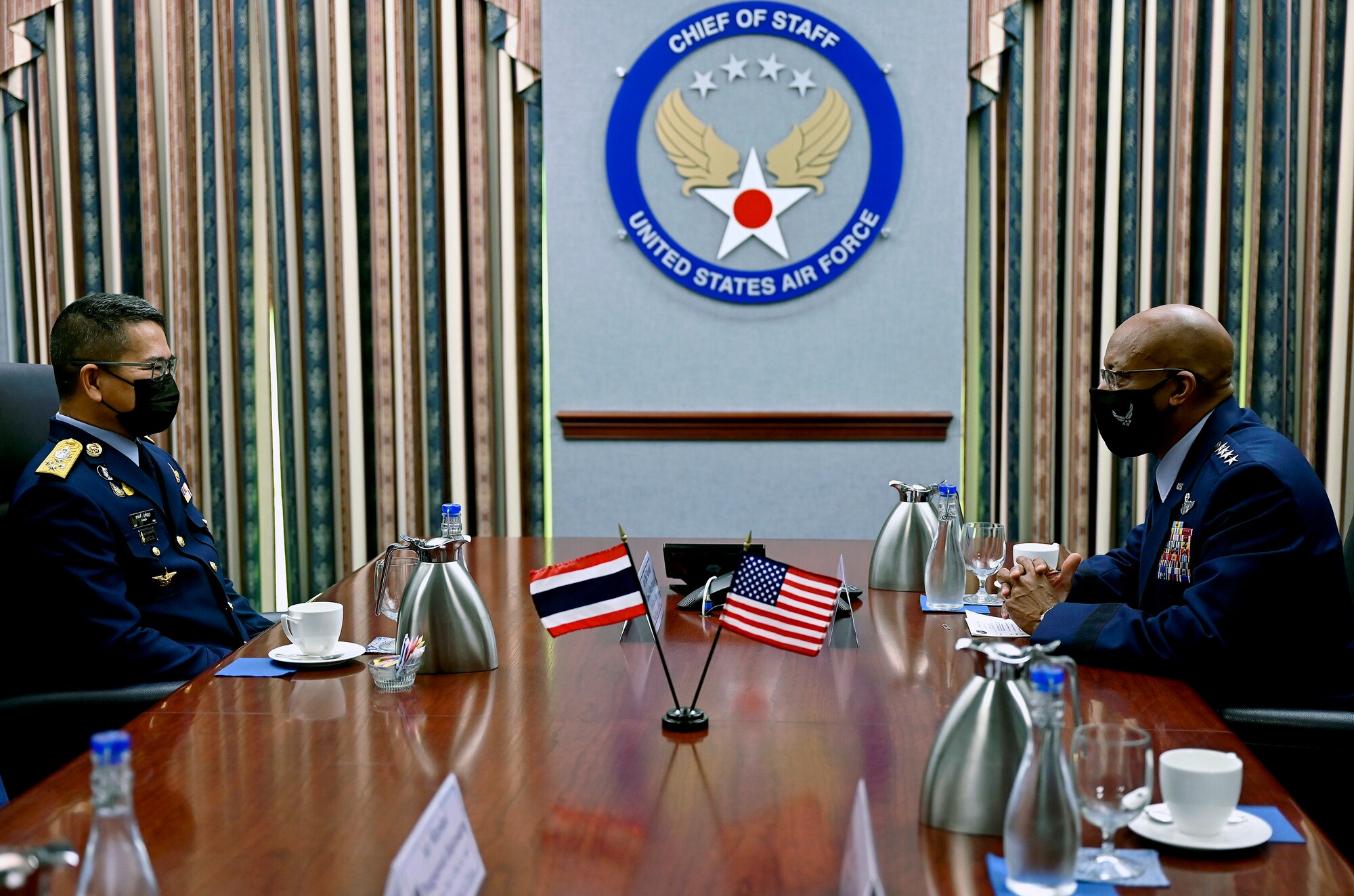 Gen. CQ Brown, Jr., right, speaks with Air Chief Marshal Chanon Mungthanya