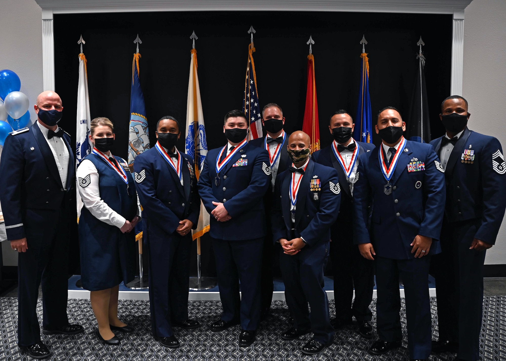 Inductees and leadership pose for a photo at the Senior Noncommissioned Officer Induction Ceremony.