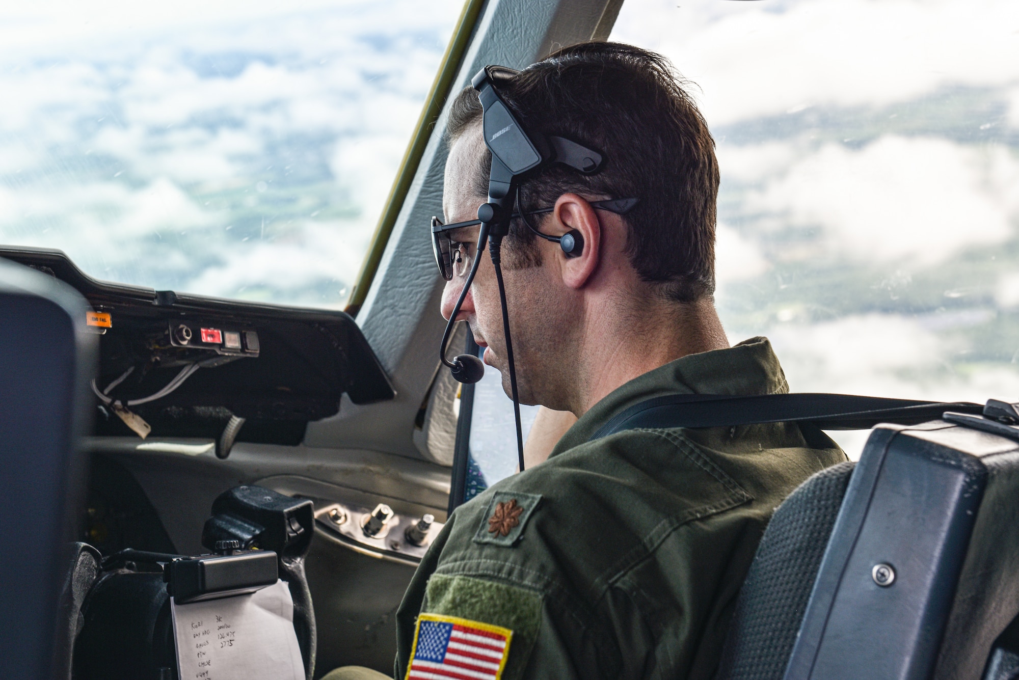 U.S. Air Force Maj. Thomas C. deCiutiis, 305th Operations Support Squadron deputy chief of the Formal Training Unit and instructor pilot, co-pilots a KC-10 Extender and observes training during a flight at Joint Base McGuire-Dix-Lakehurst, N.J., July 8, 2021. It is the instructor’s responsibility to both guide the student and maintain the safety of the aircraft and its crew during an in-flight training.