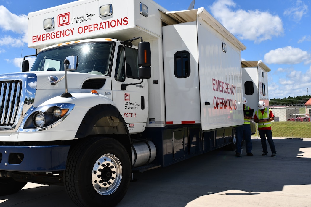 U.S. Army Corps of Engineers (USACE) Mobile District’s Emergency Command and Control Vehicle (ECCV) #3 and Deployable Tactical Operations System (DTOS) teams stand ready to provide assistance following Hurricane Ida, 31 Aug. 2021, at the Camp Shelby, Mississippi, staging area.