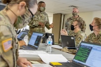 Sgt. Maj. Darnell Cabell, senior enlisted leader and principle advisor to the military deputy to the Assistant Secretary of the Army for Financial Management and Comptroller, talks with finance and comptroller Soldiers participating in a Diamond Saber exercise during a visit to Fort McCoy, Wisconsin, Aug. 17, 2021. Diamond Saber is a U.S. Army Reserve-led exercise that incorporates all Army components and joint services, and it prepares finance and comptroller Soldiers on warfighting functions such as funding the force, payment support, disbursing operations, accounting, fiscal stewardship, auditability and data analytics. (U.S. Army photo by Mark R. W. Orders-Woempner)
