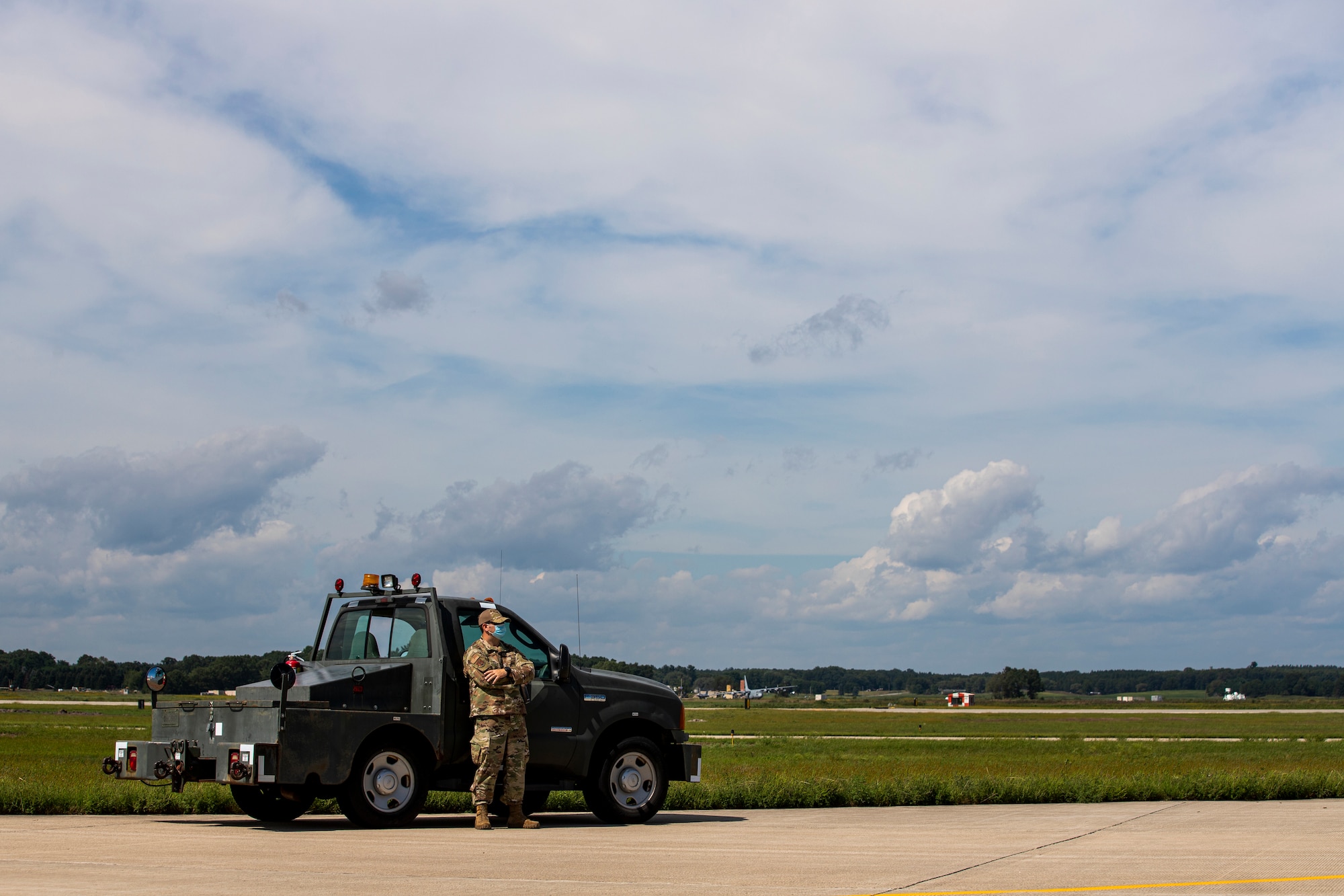 An Airman from the Kentucky Air National Guard's 123rd Contingency Response Group prepares to receive an aircraft carrying Afghan evacuees at Volk Field, Wis., Aug. 29, 2021. The Department of Defense, in support of the Department of Homeland Security and the Department of State, is providing transportation and temporary housing for evacuees as part of Operation Allies Refuge. The initiative follows through on America’s commitment to Afghan personnel who have helped the United States, and provides them essential support at secure locations outside Afghanistan. (U.S. Army photo by Spc. Rhianna Ballenger, 55th Signal Company)