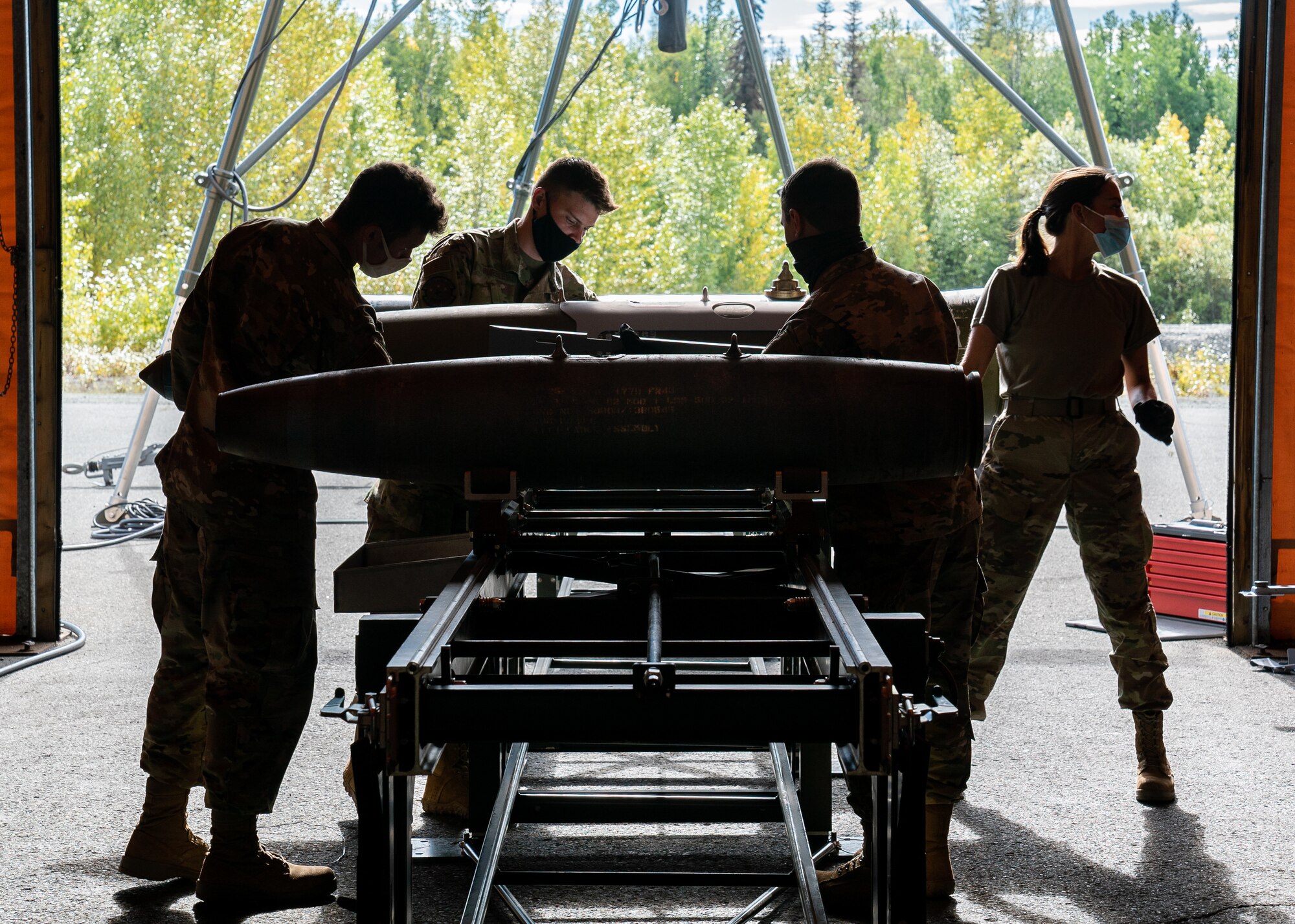 U.S. Air Force Airmen assigned to the 3rd Munitions Squadron demonstrate their bomb building capabilities during a 3rd Wing immersion tour at Joint Base Elmendorf-Richardson, Alaska.