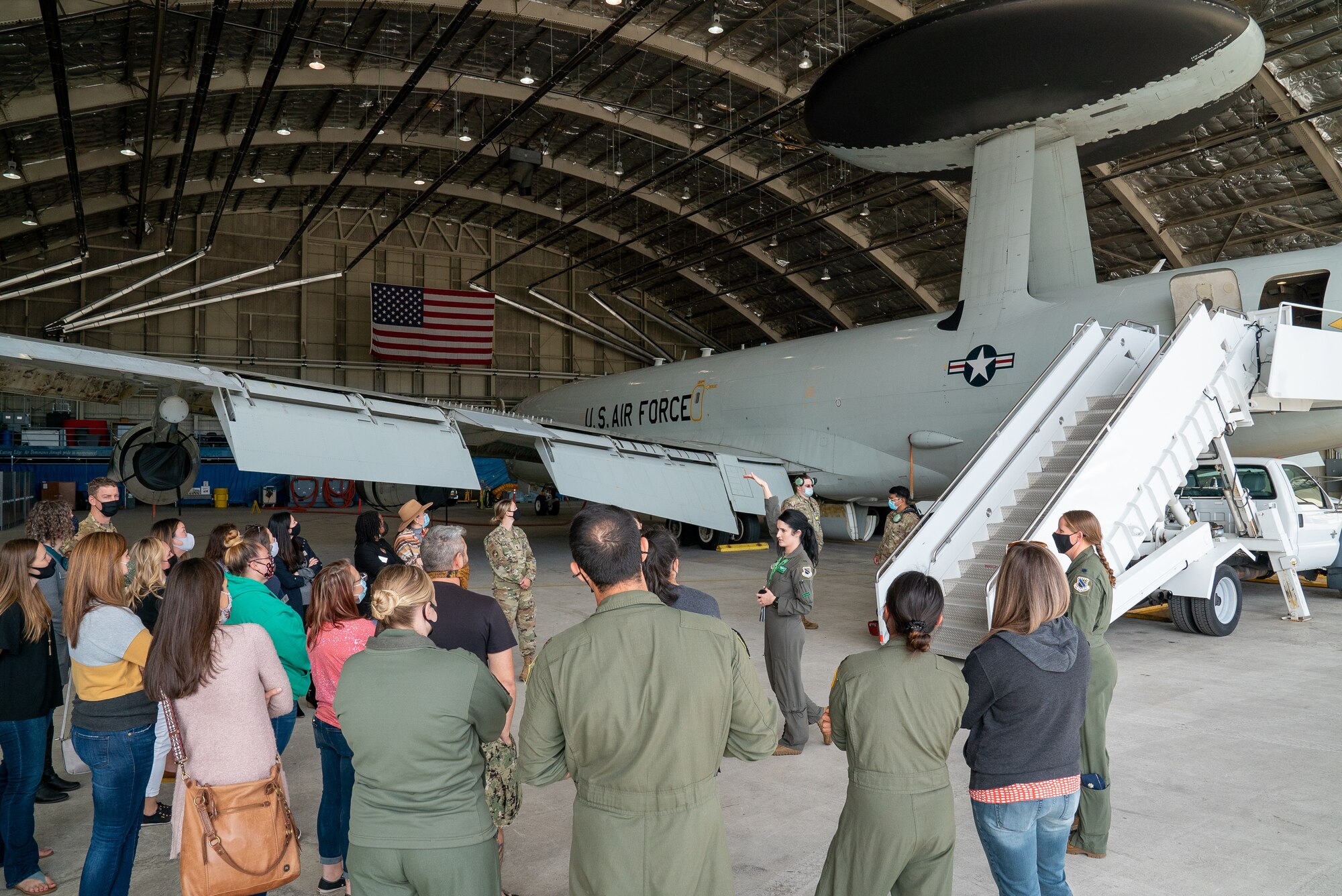 Spouses from the 3rd Wing receive a briefing on the E-3 Sentry Airborne Warning and Control System during an immersion tour at Joint Base Elmendorf-Richardson, Alaska.