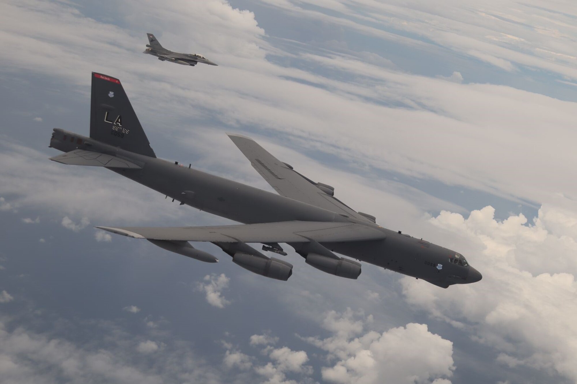 A U.S. Air Force B-52 Stratofortress assigned to the 2nd Bomb Wing, Barksdale Air Force Base, Louisiana, flies next to an Indonesian Air Force F-16 during a Bomber Task Force (BTF) deployment in the Indo-Pacific region, Sept. 1, 2021. This is the first time a B-52 has integrated with the Indonesian Air Force during flight. BTF missions demonstrate the credibility of our forces to address a diverse and uncertain security environment.  (Courtesy Photo of Indonesian Air Force)