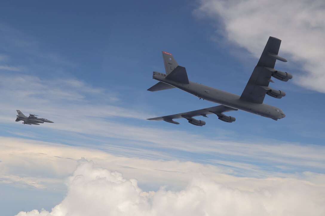 A U.S. Air Force B-52 Stratofortress assigned to the 2nd Bomb Wing, Barksdale Air Force Base, Louisiana, flies next to an Indonesian Air Force F-16 during a Bomber Task Force (BTF) deployment in the Indo-Pacific region, Sept. 1, 2021. This is the first time a B-52 has integrated with the Indonesian Air Force during flight. BTF missions demonstrate the credibility of our forces to address a diverse and uncertain security environment.  (Courtesy Photo of Indonesian Air Force)