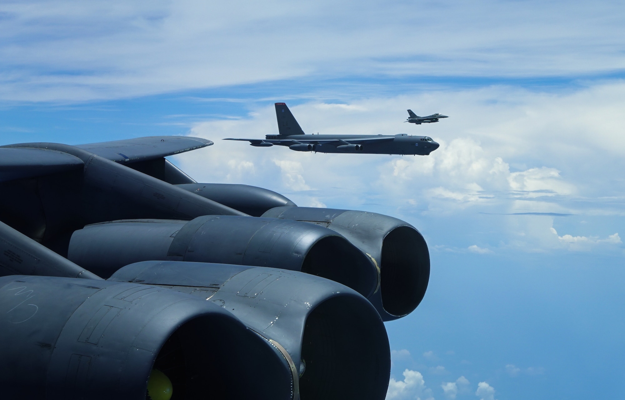 A U.S. Air Force B-52 Stratofortress assigned to the 2nd Bomb Wing, Barksdale Air Force Base, Louisiana, flies next to an Indonesian Air Force F-16 during a Bomber Task Force (BTF) deployment in the Indo-Pacific region, Sept. 1, 2021. This is the first time a B-52 has integrated with the Indonesian Air Force during flight. BTF missions demonstrate the credibility of our forces to address a diverse and uncertain security environment. (U.S. Air Force photo by Tech. Sgt. Matthew Lotz)