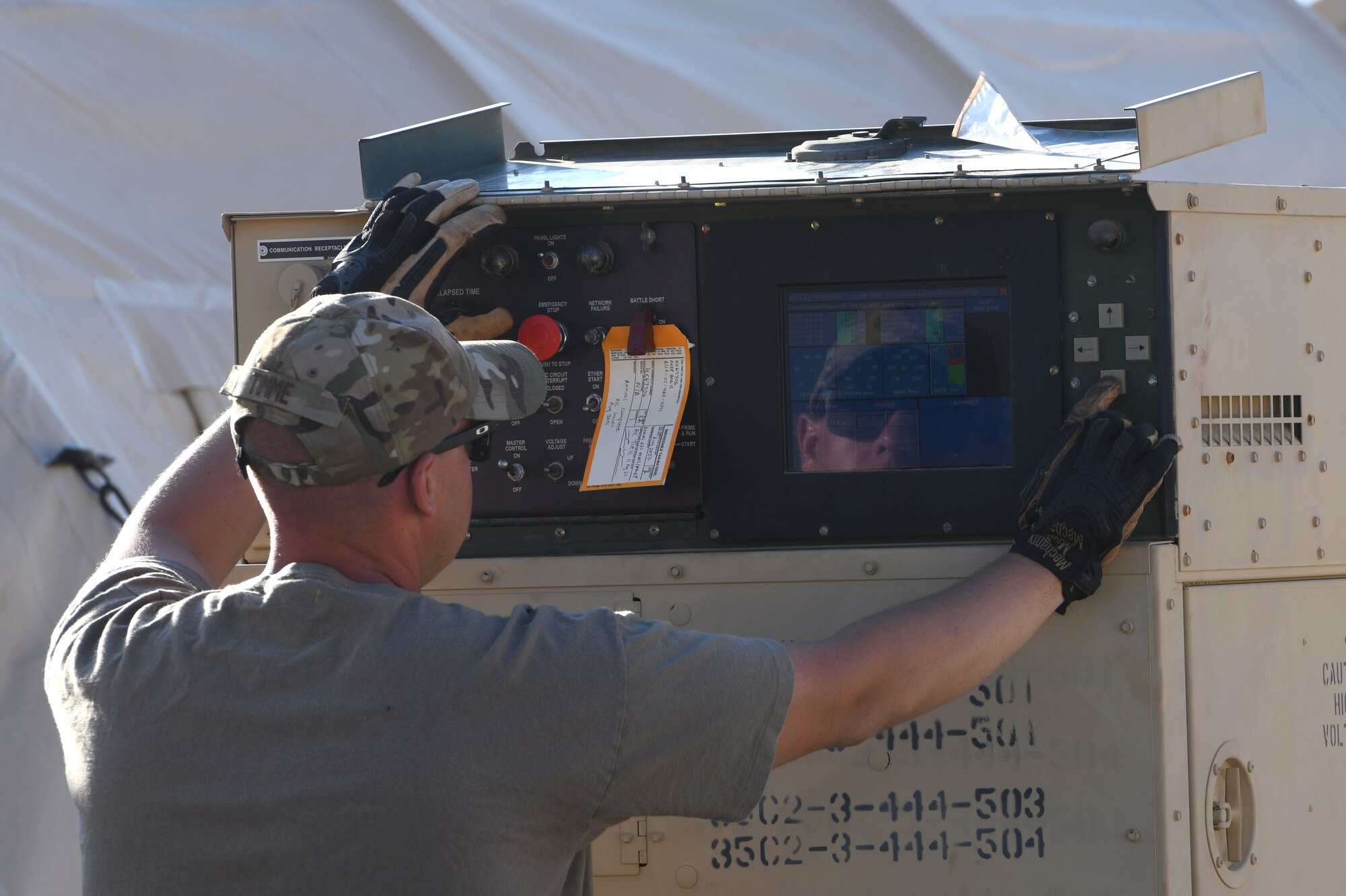 U.S. Air Force Tech. Sgt. Brady Timme, 635th Materiel Maintenance Squadron electrical power production member, sets up a generator to power housing tents in support of Operation Allies Welcome, August 28, 2021, on Holloman Air Force Base, New Mexico.. The Department of Defense, through U.S. Northern Command, and in support of the Department of Homeland Security, is providing transportation, temporary housing, medical screening, and general support for up to 50,000 Afghan evacuees at suitable facilities, in permanent or temporary structures, as quickly as possible. This initiative provides Afghan personnel essential support at secure locations outside Afghanistan. (U.S. Air Force photo by Staff Sgt. Timothy Young)
