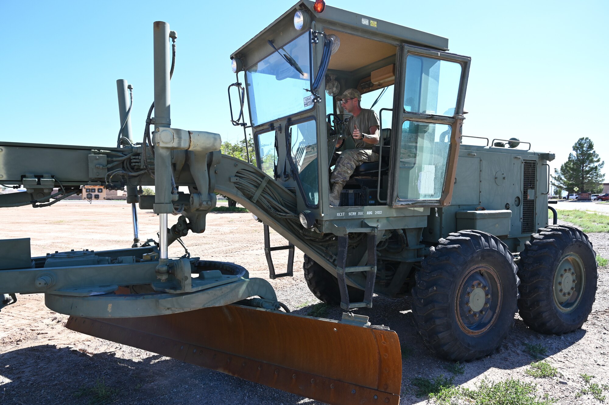 Senior Airman Tyler Amrol, 49th Civil Engineer Squadron pavement and construction equipment journeyman, starts a paver engine at future housing site for Task Force-Holloman personnel Aug. 26, 2021 on Holloman Air Force Base, New Mexico. The Department of Defense, through U.S. Northern Command, and in support of the Department of Homeland Security, is providing transportation, temporary housing, medical screening, and general support for up to 50,000 Afghan evacuees at suitable facilities, in permanent or temporary structures, as quickly as possible. This initiative provides Afghan personnel essential support at secure locations outside Afghanistan. (U.S. Air Force photo by Tech. Sgt. BreeAnn Sachs)