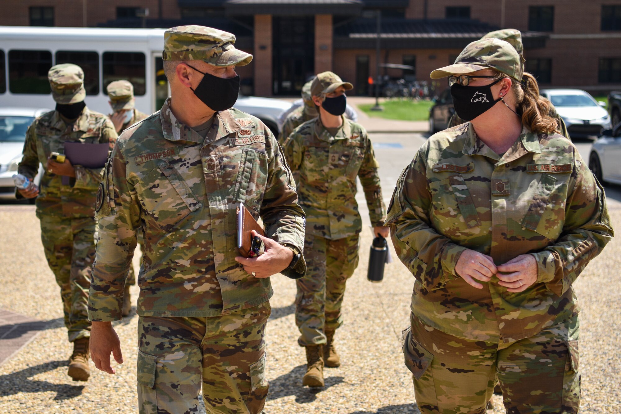 AETC command chief enters building.