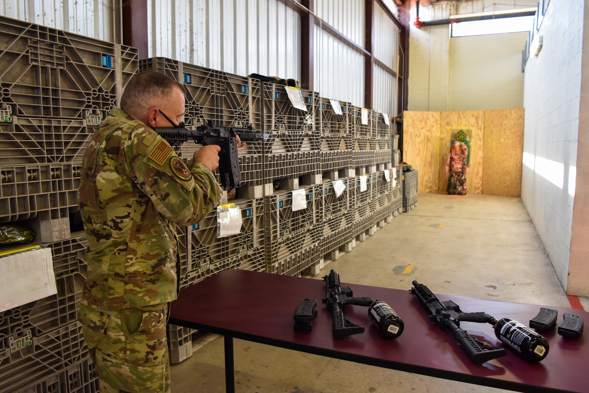 AETC command chief fires paint ball gun.