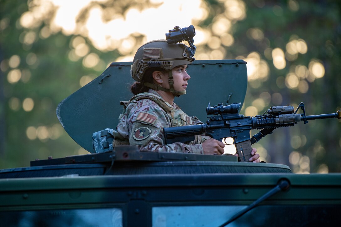Photo of Airman in the hatch of a Humvee