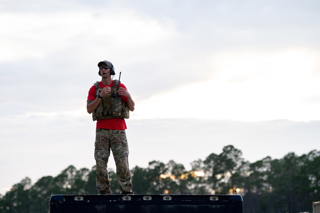 Photo of Airman using a radio