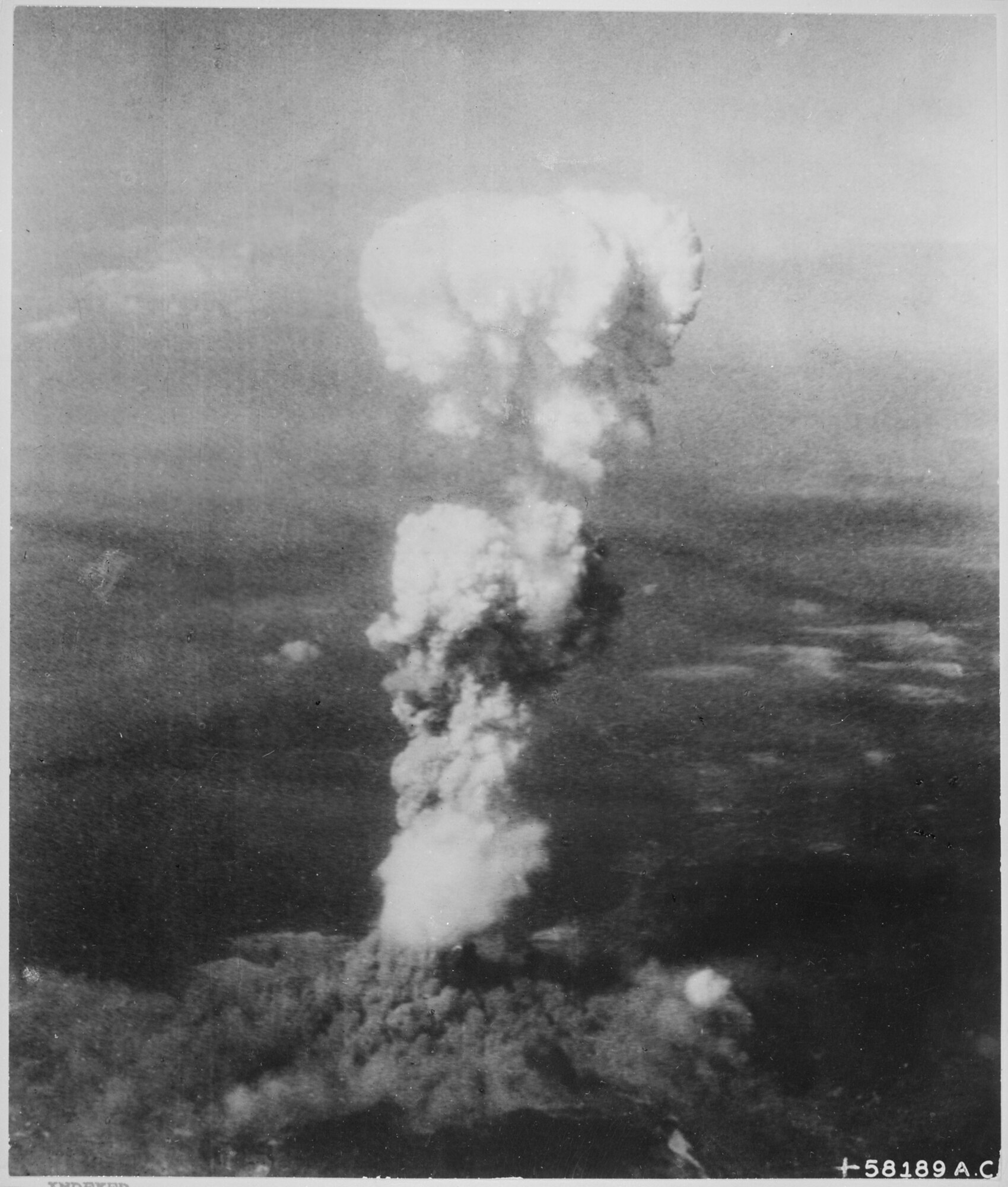 The atomic bomb, dropped by the crew of the 509th Composite Group's B-29 Superfortress Enola Gay, detonates over Hiroshima, Japan. The first of two historic drops, these missions contributed to forcing Japan to surrender, ending World War II. (U.S. Army Air Forces file photo)