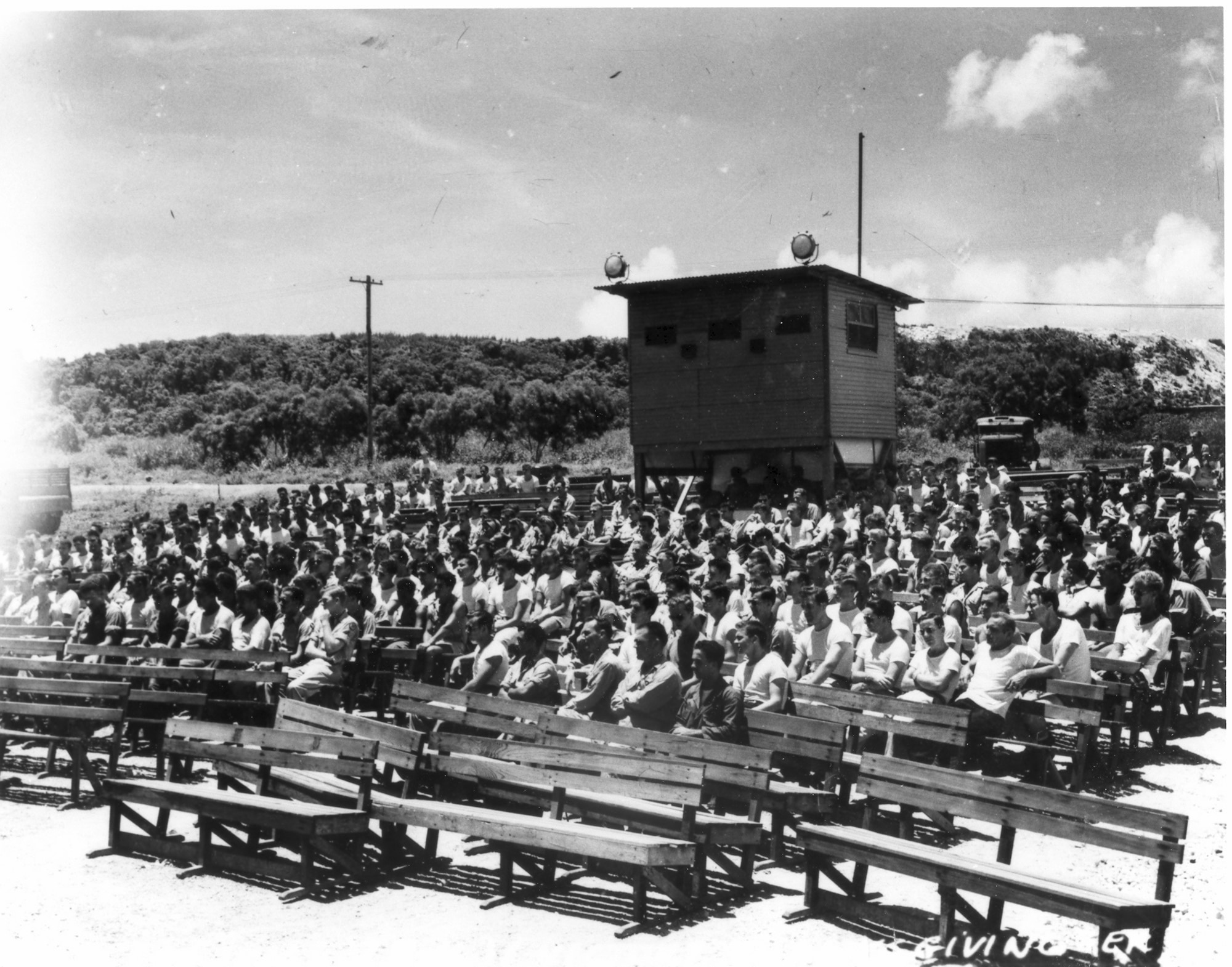 Members of the 509th Composite Group gather for a chaplain-led service on Tinian, 1945, following the surrender of the Japanese Empire. (U.S. Army Air Forces file photo)