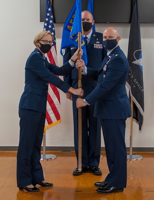 Maj. Gen. Heather Pringle, commander of Air Force Research Laboratory, transfers the AFRL Detachment 7 guidon and leadership to Lt. Col. Robert Volesky during an assumption of commander ceremony at Edwards Air Force Base, California, Aug. 27. (Air Force courtesy photo)