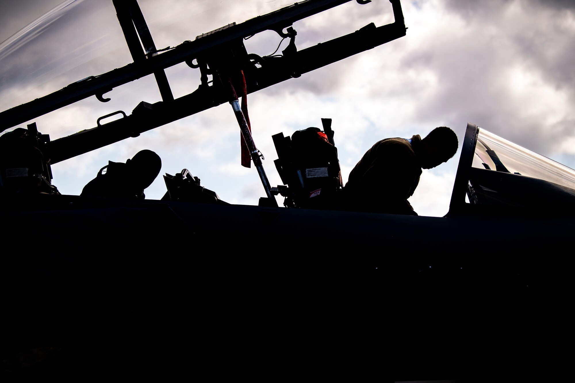 Airmen from the 48th Aircraft Maintenance Squadron inspect the cockpit of an F-15E Strike Eagle during an Agile Combat Employment exercise at RAF Fairford, England, Aug. 23, 2021. Utilizing ACE concepts ensures that U.S. forces in Europe are better equipped to operate from locations with varying levels of capacity and support to accomplish the mission. This further ensures Airmen and aircrews are postured to deliver lethal combat power across the full spectrum of military operations. (U.S. Air Force photo by Senior Airman Eugene Oliver)