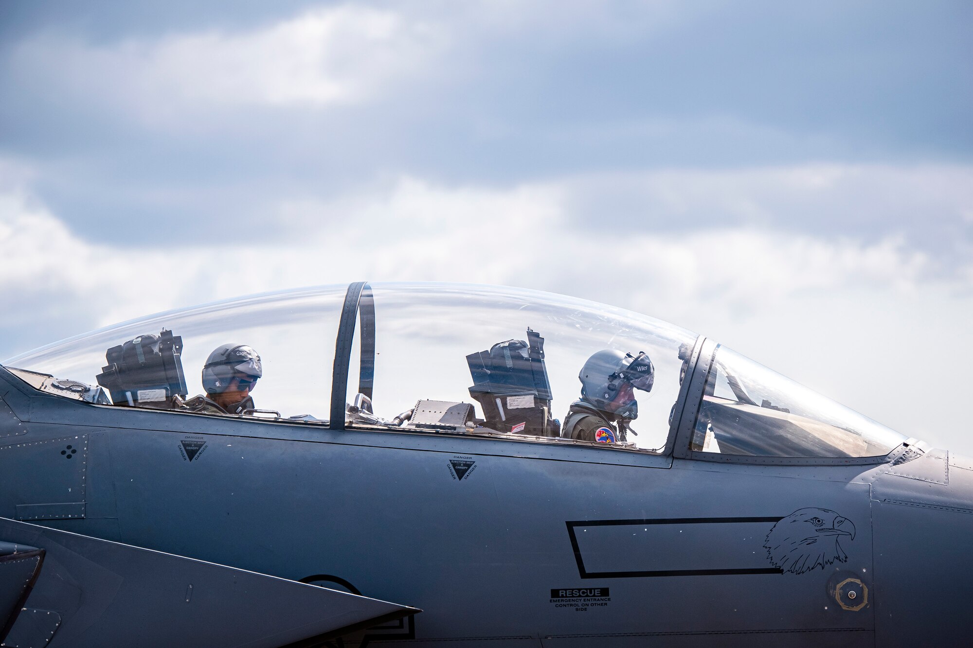 U.S. Air Force 1st Lt. Kyle Gager, left, 492d Fighter Squadron weapons systems officer, and 1st Lt. Zach Wiles, 492d FS pilot, sit in the cockpit of an F-15E Strike Eagle during an Agile Combat Employment exercise at RAF Fairford, England, Aug. 23, 2021. Utilizing ACE concepts ensures that U.S. forces in Europe are better equipped to operate from locations with varying levels of capacity and support to accomplish the mission. This further ensures Airmen and aircrews are postured to deliver lethal combat power across the full spectrum of military operations. (U.S. Air Force photo by Senior Airman Eugene Oliver)