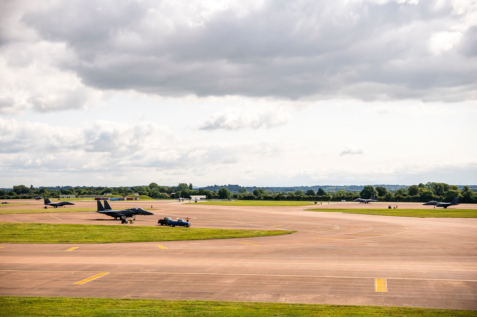Six F-15E Strike Eagles assigned to the 492d Fighter Squadron, static during an Agile Combat Employment exercise at RAF Fairford, England, Aug 23, 2021. The exercise enables U.S. forces in Europe to operate from locations with varying levels of capacity and support. This further ensures Airmen and aircrews are postured to deliver lethal combat power across the full spectrum of military operations. (U.S. Air Force photo by Senior Airman Eugene Oliver)