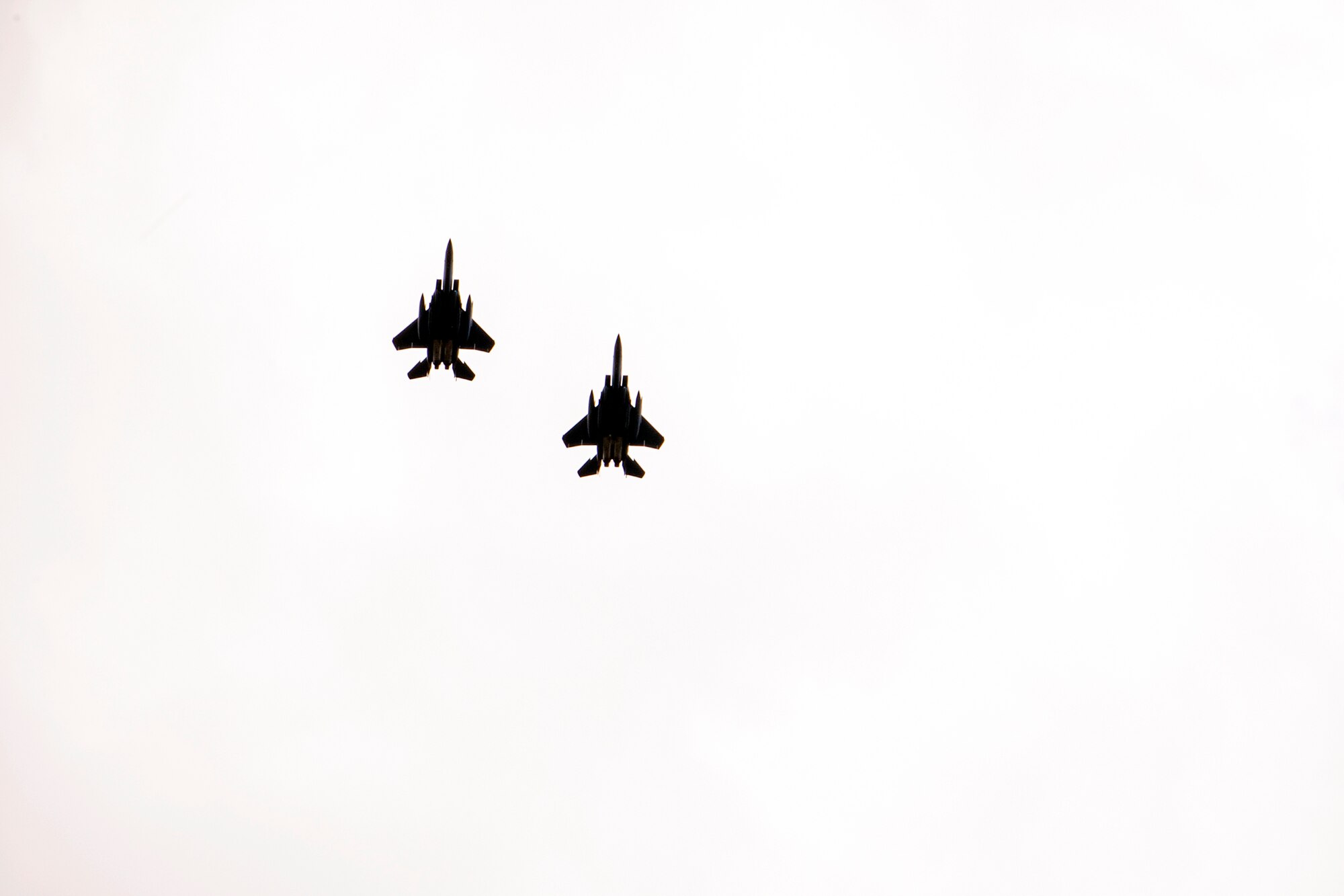 Two F-15E Strike Eagles assigned to the 492d Fighter Squadron, fly overhead during an Agile Combat Employment exercise at RAF Fairford, England, Aug. 23, 2021. The exercise enables U.S. forces in Europe to operate from locations with varying levels of capacity and support. This further ensures Airmen and aircrews are postured to deliver lethal combat power across the full spectrum of military operations. (U.S. Air Force photo by Senior Airman Eugene Oliver)