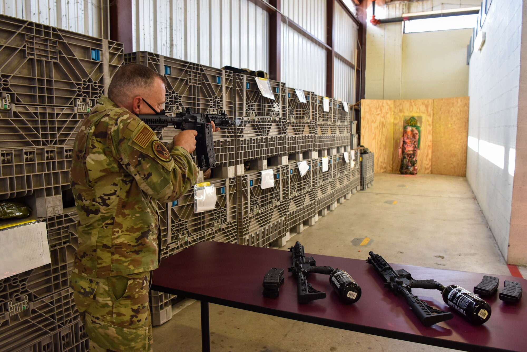 AETC command chief fires paint ball gun.