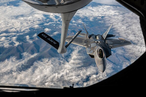 A jet prepares to refuel mid-air.