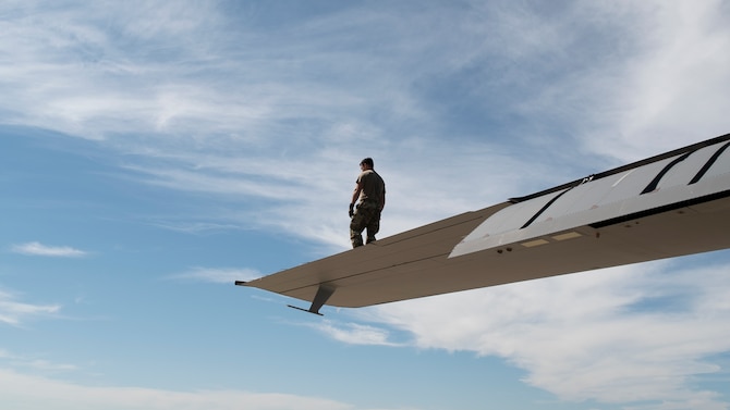 U.S. Air Force Master Sgt. Robert Turner, 27th Special Operations Group, Detachment 2 lead gunner, conducts a wing walk on an AC-130J Ghostrider gunship aircraft during pre-flight
inspections for a training flight at Cannon Air Force Base, N.M., Aug. 19, 2021. The flight marked Cannon AFB history as the first local flight of an AC-130J around New Mexico’s Curry and Roosevelt counties. (U.S. Air Force photo by Senior Airman Christopher Storer)